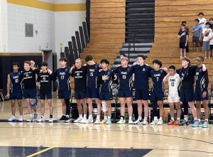 Boys Volleyball lines up for the National Anthem prior to the Group 2 state final on Wednesday, June 11. 