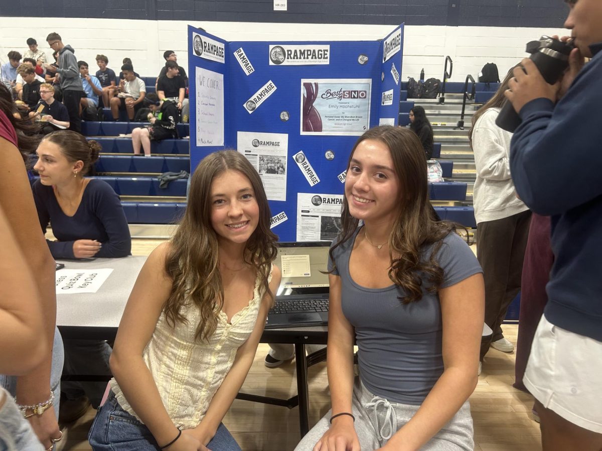 Seniors Amelia Kolbik (left) and Sydney Wright represent Rampage at the annual RHS Club Fair, on Wednesday, Sept. 18, 2025.