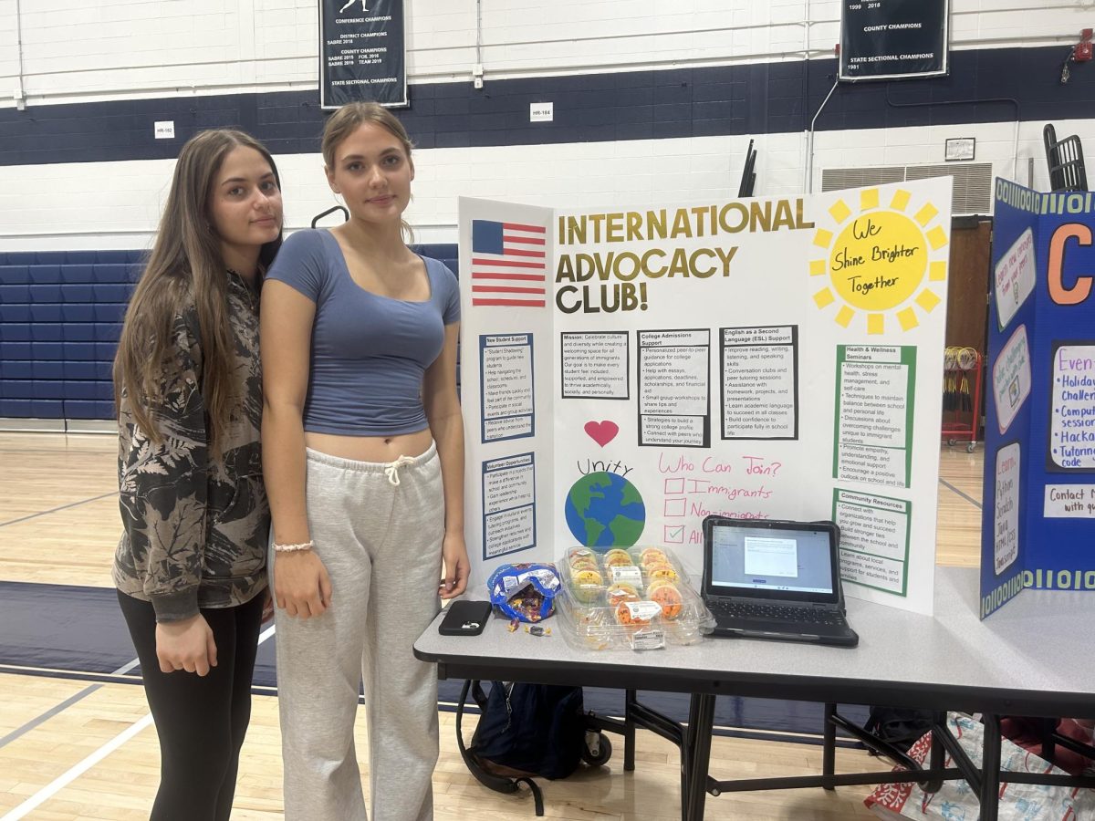 Senior Anna Jankowska (left) and junior Aleksandra Jankowska showcase the International Advocacy Club at the annual RHS Club Fair, on Wednesday, Sept. 18, 2025. .