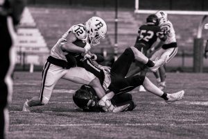 Senior Ram Steven Nostrame (12) fights off a Teaneck Highwayman for extra yardage in Randolph Football's season opener on Friday, August 29, 2025. 