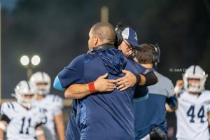 RHS Football Coaches Ryan Gresik (left) and Paul Conboy hug during a tough game against Warren Hills on Oct. 3, 2025.