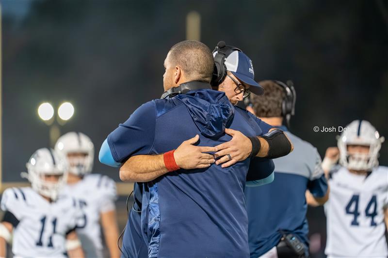 RHS Football Coaches Ryan Gresik (left) and Paul Conboy hug during a tough game against Warren Hills on Oct. 3, 2025.