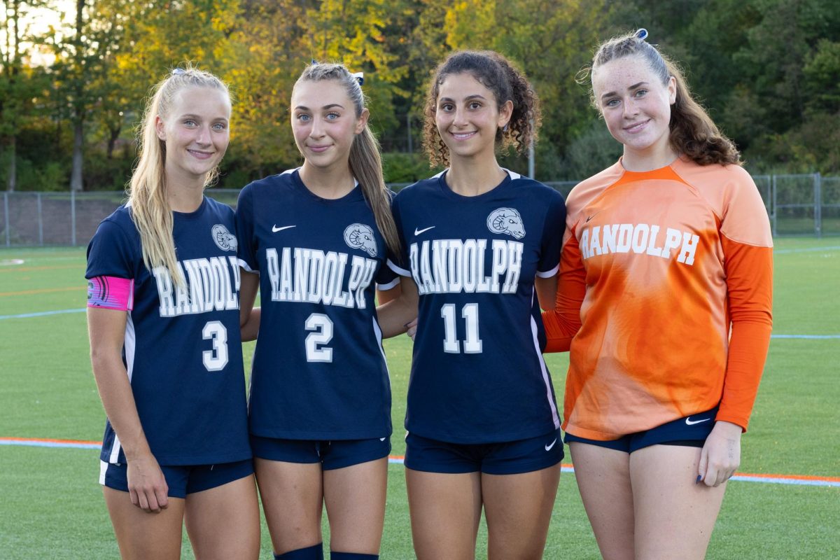 Seniors on the Girls Soccer team strike a pose on Senior Night, Friday, Sept. 26, 2025. From left: Carlie Wysocki, Pia DiGregorio, Reina Daniel and Jamie Donnelly. 
