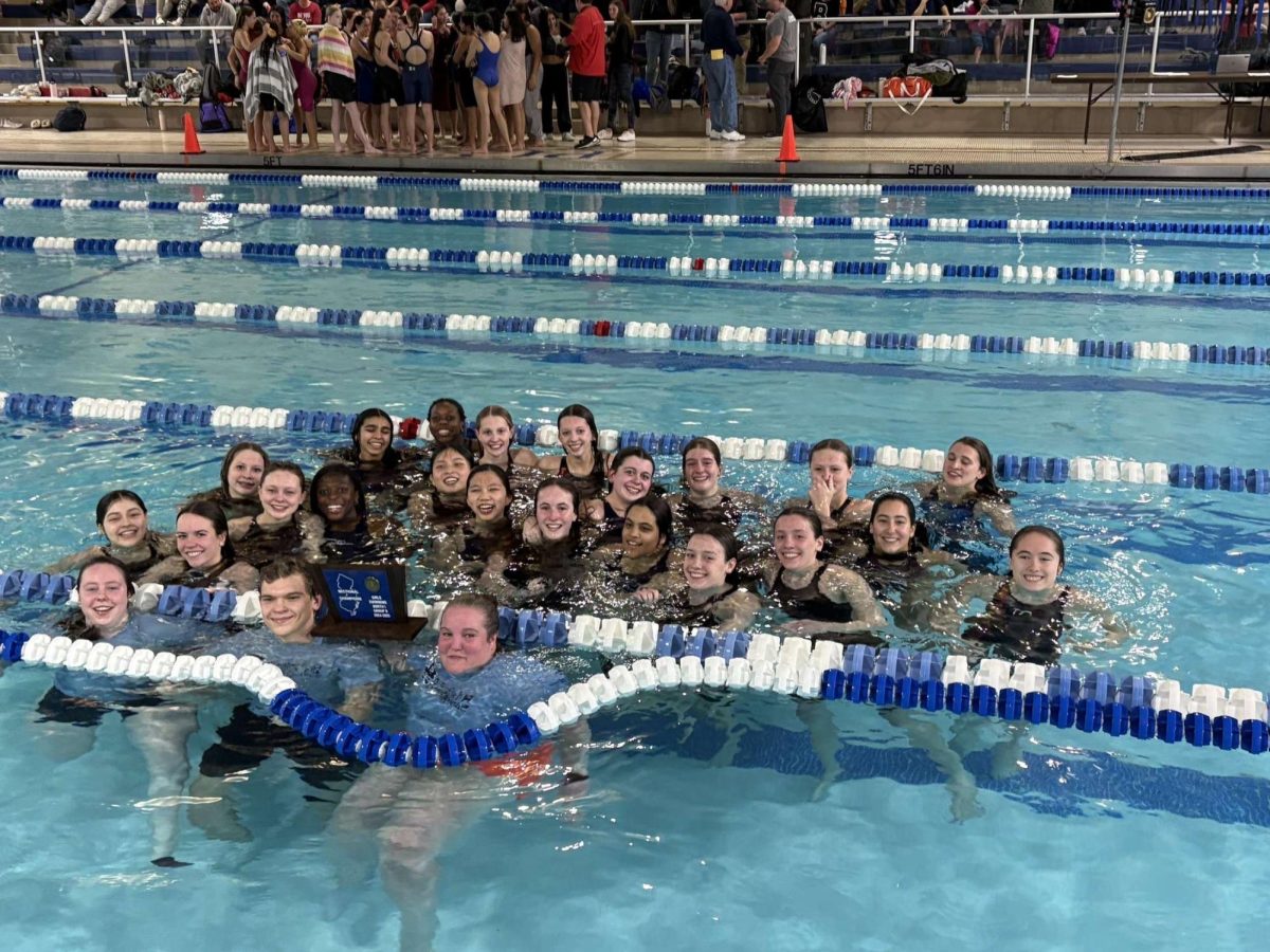The 2024-2025 Girls Swim team celebrates in the water after winning the state sectional championship on Feb. 12, 2025.  
