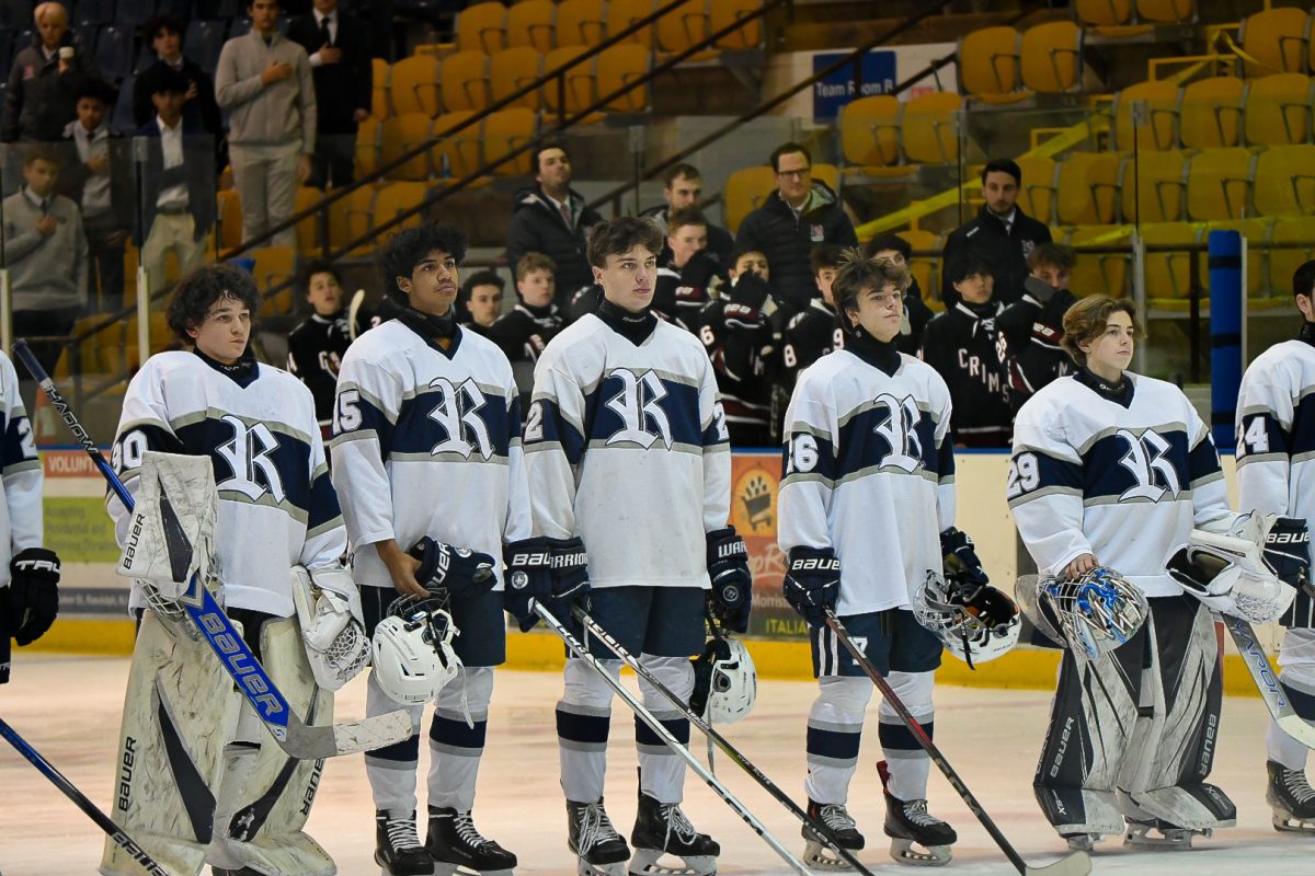 From left: Quincy Mitchell, Justin Kinnier, Shane Melly, Ryan Thomas and Zach Levesque stand for the national anthem before last year's Boys Ice Hockey state final on Jan. 15, 2025. 