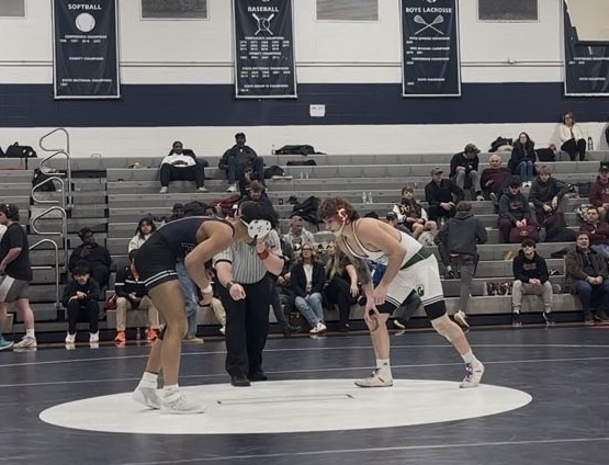 Wrestler Manny Samaniego ('28) wins a 165-pounds match last season, on Saturday, Feb. 15, 2025. The wrestlers are eager to prove themselves this coming 2025-2026 season in a tough state division. 
