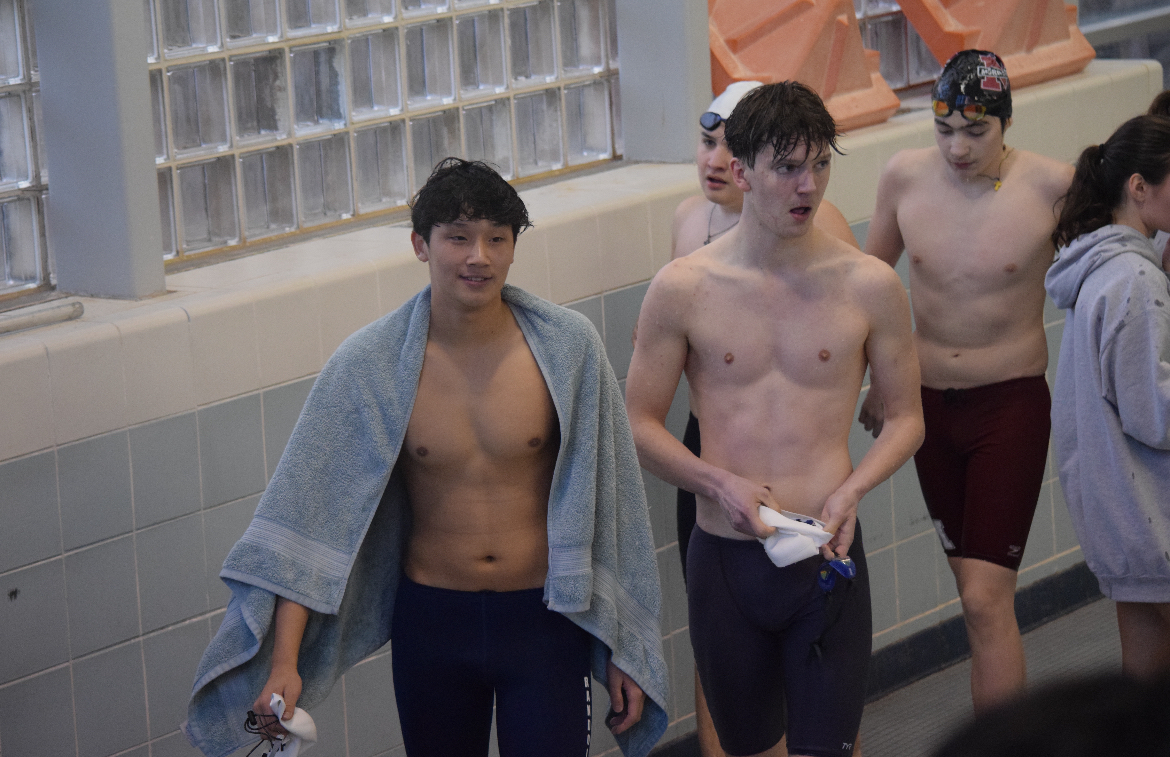 Juniors TJ Wangchuk and Gavin Drazek (front left and center) and senior Ilya Andrianov (back center) finish their relay against Morristown on Thursday, Dec. 4, 2025.
 