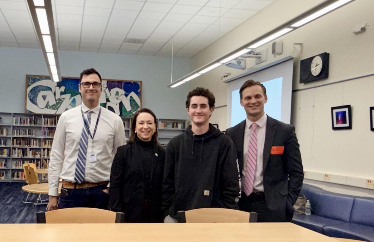State Assemblywoman Aura Dunn (second from left), accompanied by Chief of Staff Jeffrey Wood (right), spoke to AP Government and Politics and current events students at the high school on Wednesday, Dec. 3, 2025. Also pictured are Social Studies Supervisor Francis Hittinger (left) and RHS senior Eli Kahn (second from right).