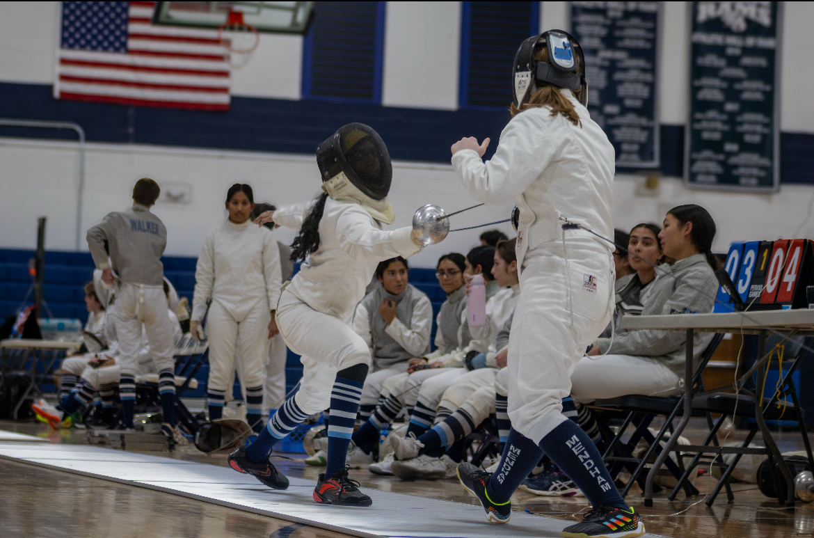 While the boys team won 15-12, the girls team (pictured) came up one bout short of victory, losing 14-13 to Mendham on Monday, Dec. 15, 2025.  