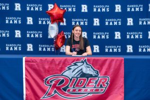 Syd Wright signs to swim for Rider University on Feb. 9, 2026. 