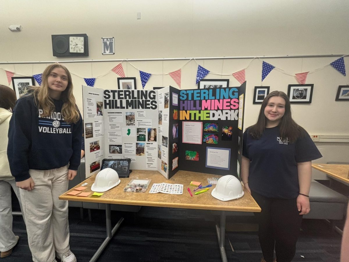 Aleksandra Jankowska (left) and Kayla Hudak present their trifold on the Sterling Hill Mine at Red, White, & Jersey at RHS on March 5, 2026.  