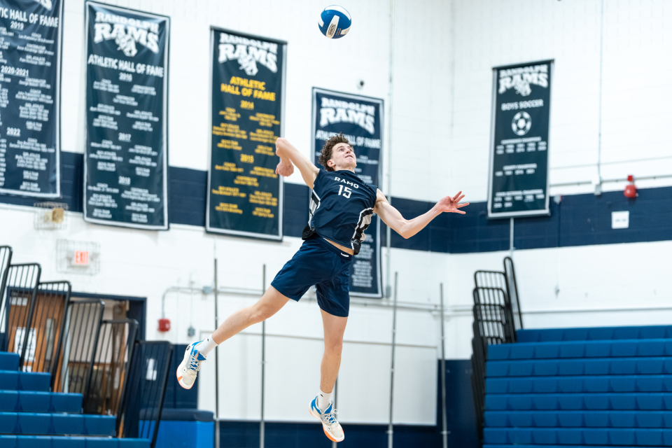 Ben Barninger goes up to serve a top spin during the home opener vs. Morristown on Wednesday, March 25, 2026. 