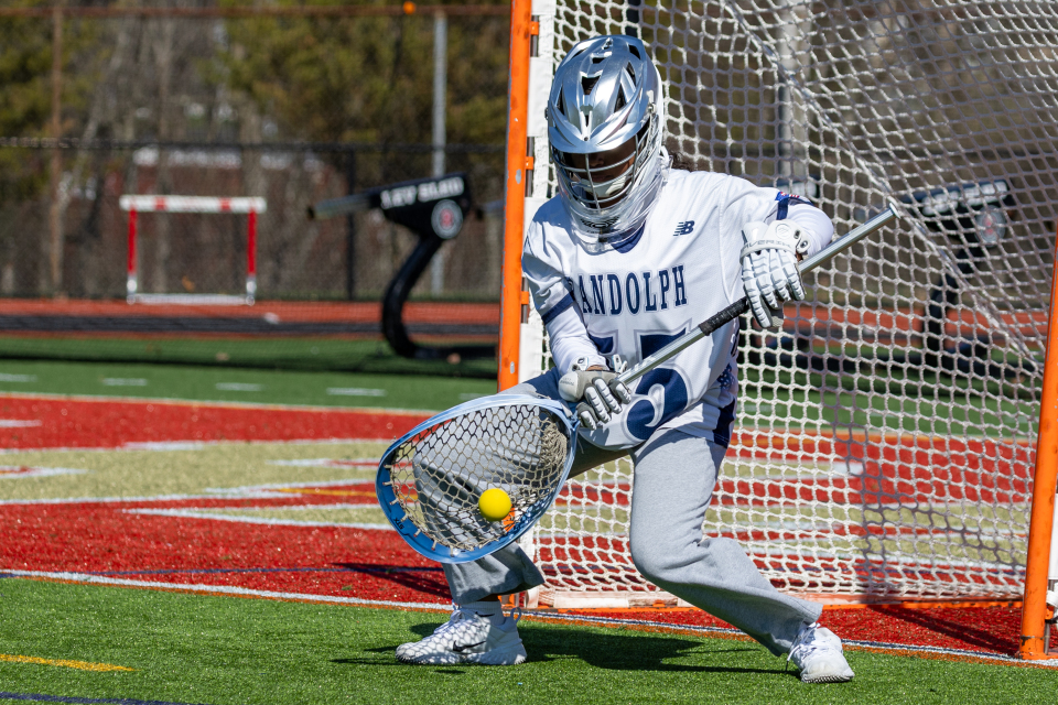 Freshman goalie Samantha Nieto saves a shot by Mount Olive on the way to a 8-7 win for Randolph on Tuesday, Apr. 7, 2026.