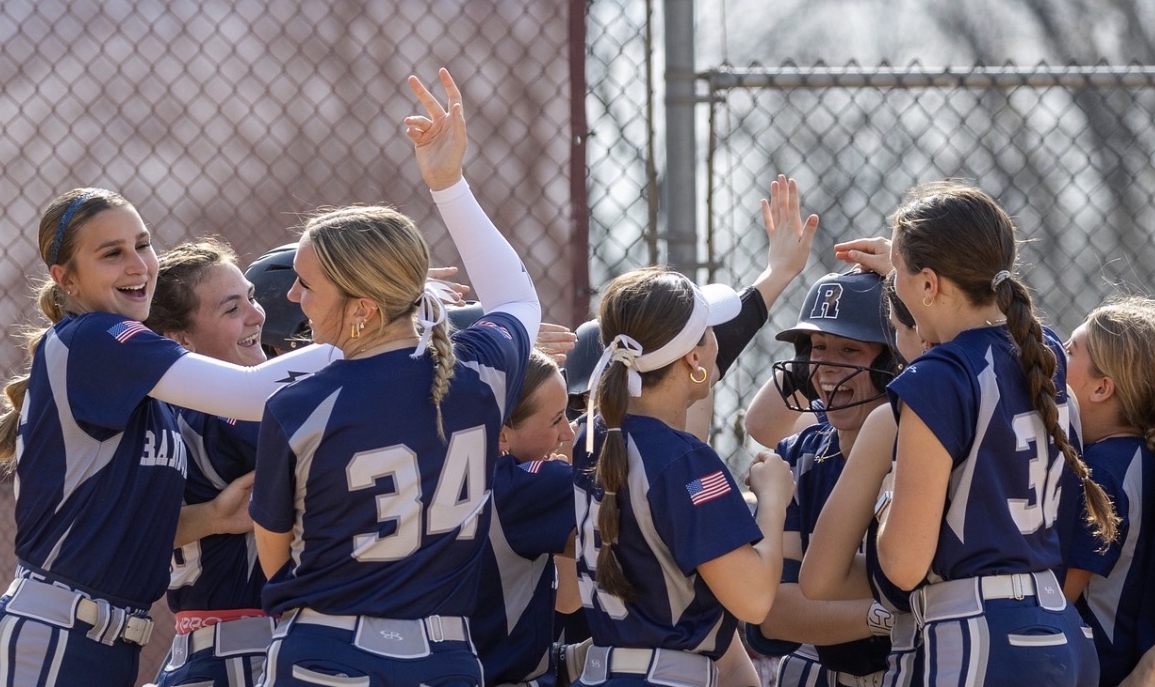 Randolph Softball celebrates a recent win. The team's record now stands at an impressive 9-2. 
