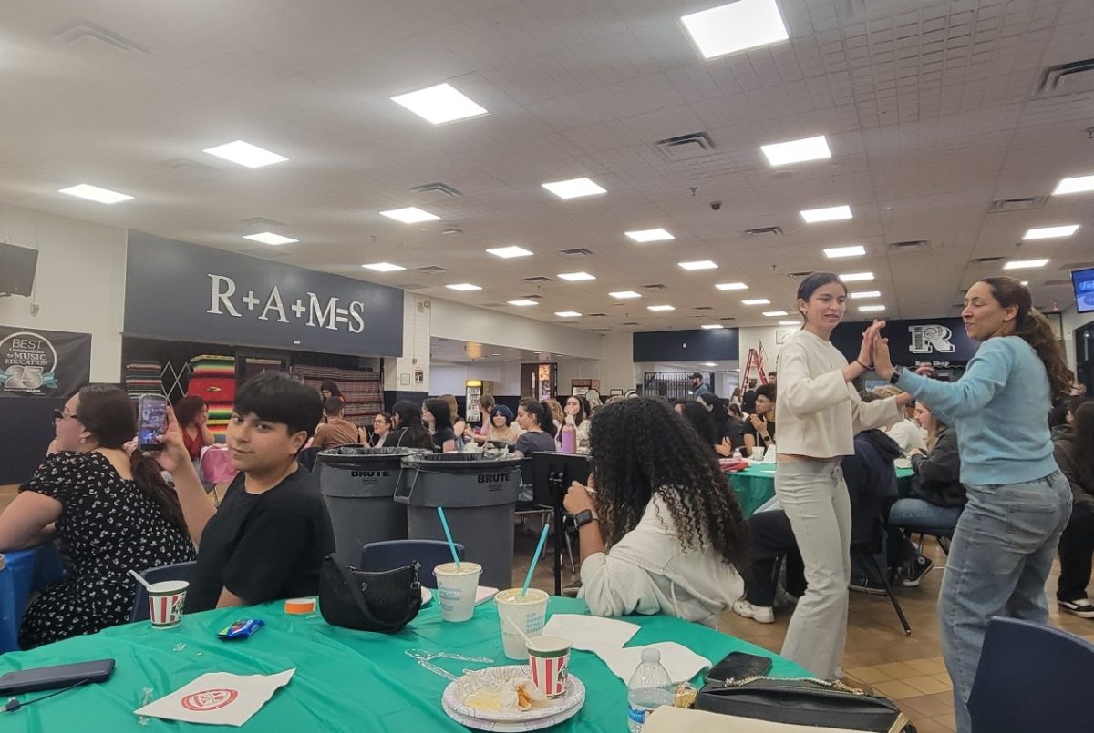 Students and family members enjoy cultural food, music and dancing during the Global Café celebration at RHS on April 24, 2026.





