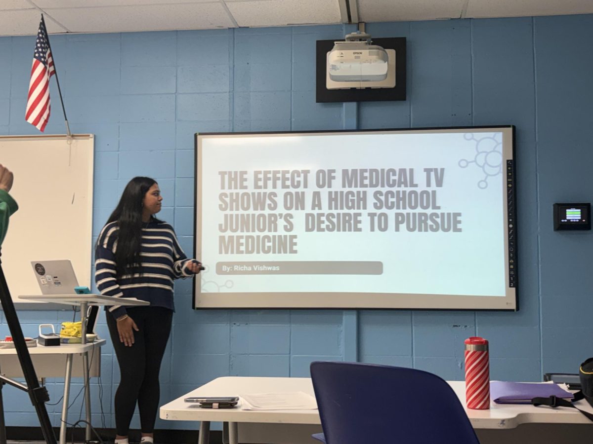 AP Research student Richa Vishwas practices her POD presentation in front of teacher Stephanie Torsiello.