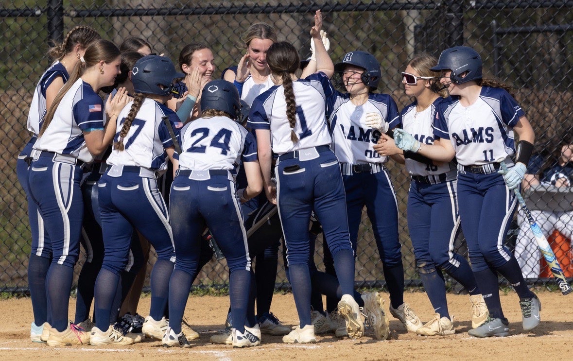The Rams huddle together in celebration after a recent win. 

