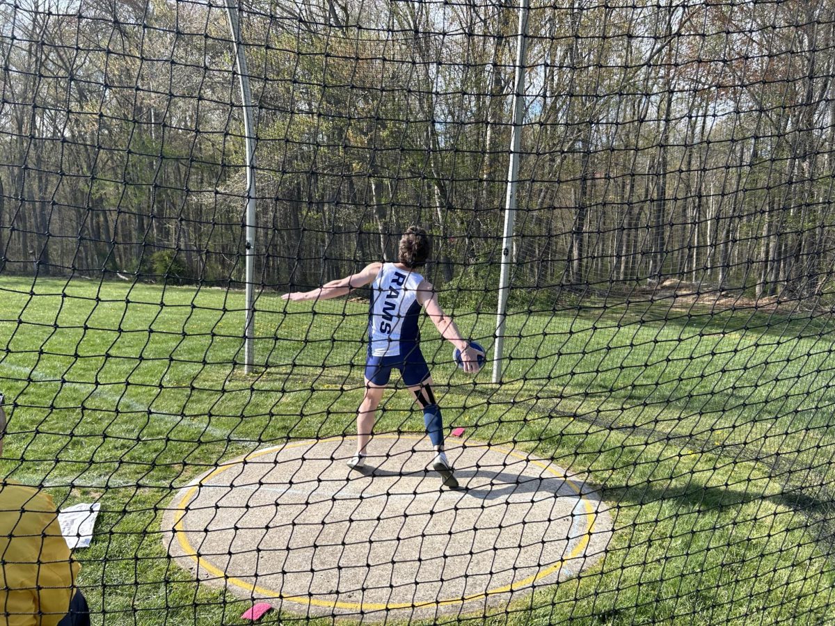 Senior captain Justin Swayze prepares to throw a discus at a recent meet during the 2025-2026 season. 