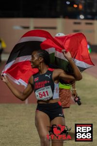 RHS track and field star Seannah Parsons carries the flag for Trinidad and Tobago, her home country, after competing in the Carifta Games on Saturday, April 4, 2026. Photo: DENNIS ALLEN for @TTGameplan