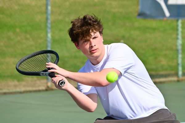 Scott Kerin concentrates on hitting his forehand during the 2025-26 Boys Tennis season. 